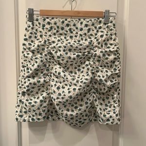Brand new mini skirt with floral print beige and green